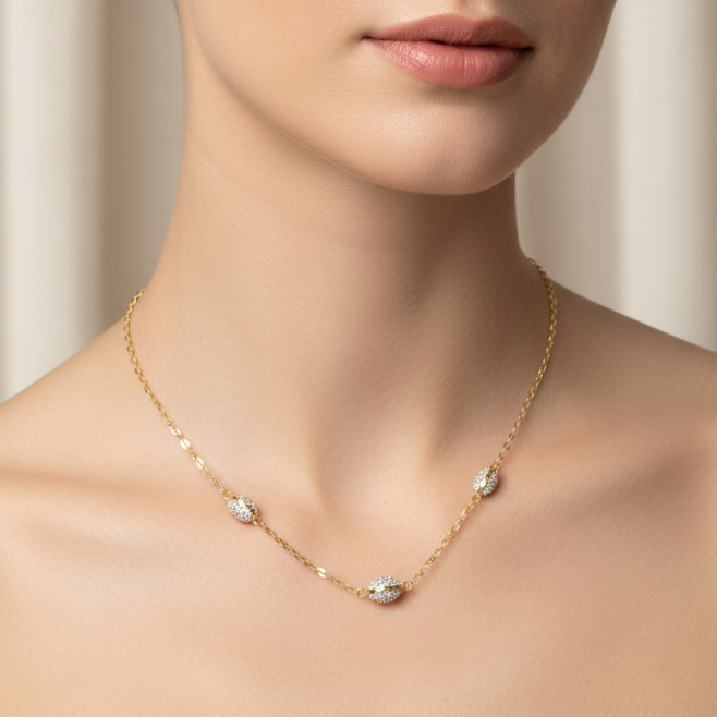 Collana con elementi ovali e zirconi in oro giallo e bianco 18KT (750) – Made in Italy