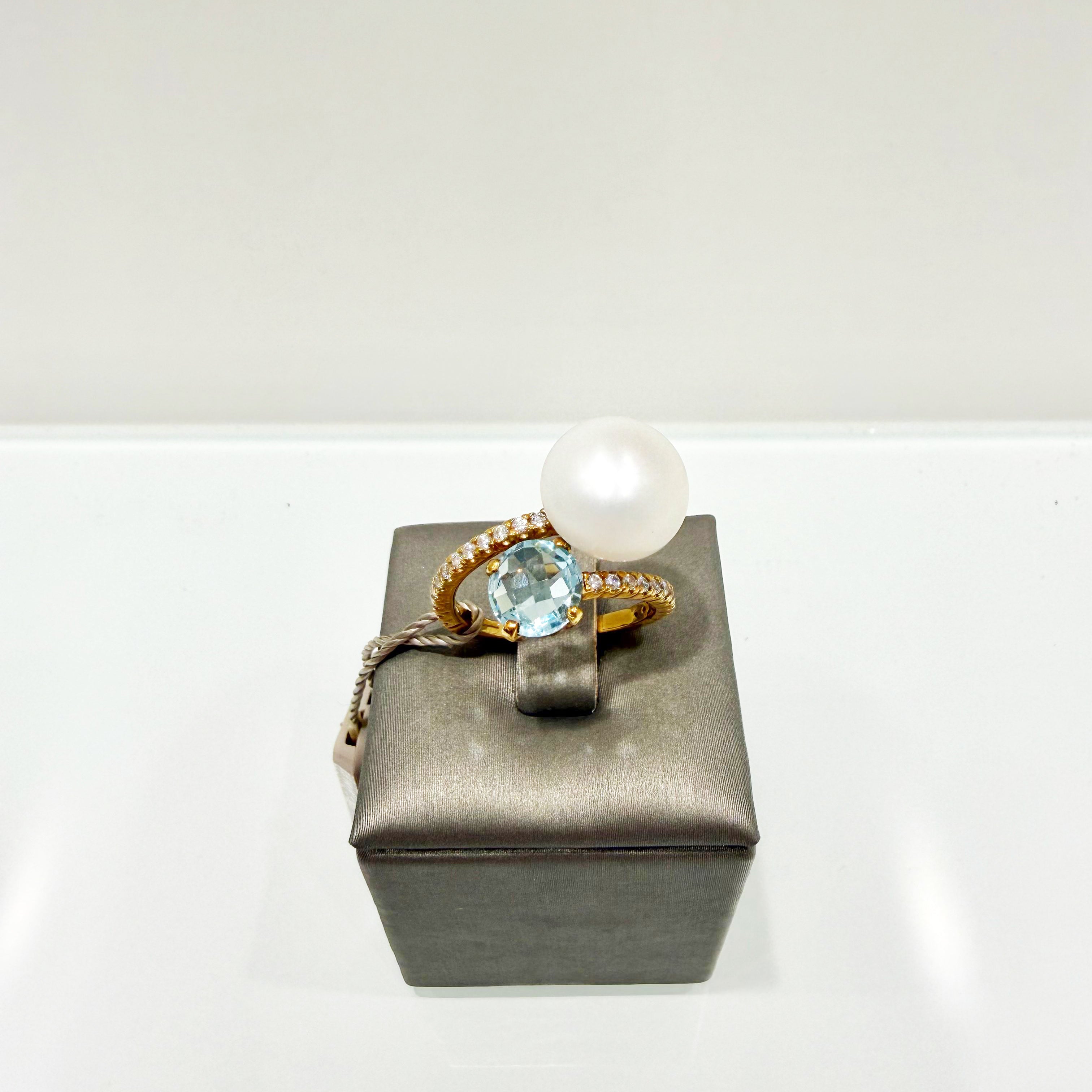 Anello contrarié con perla e topazio azzurro in oro giallo 18KT (750) con zirconi – Made in Italy