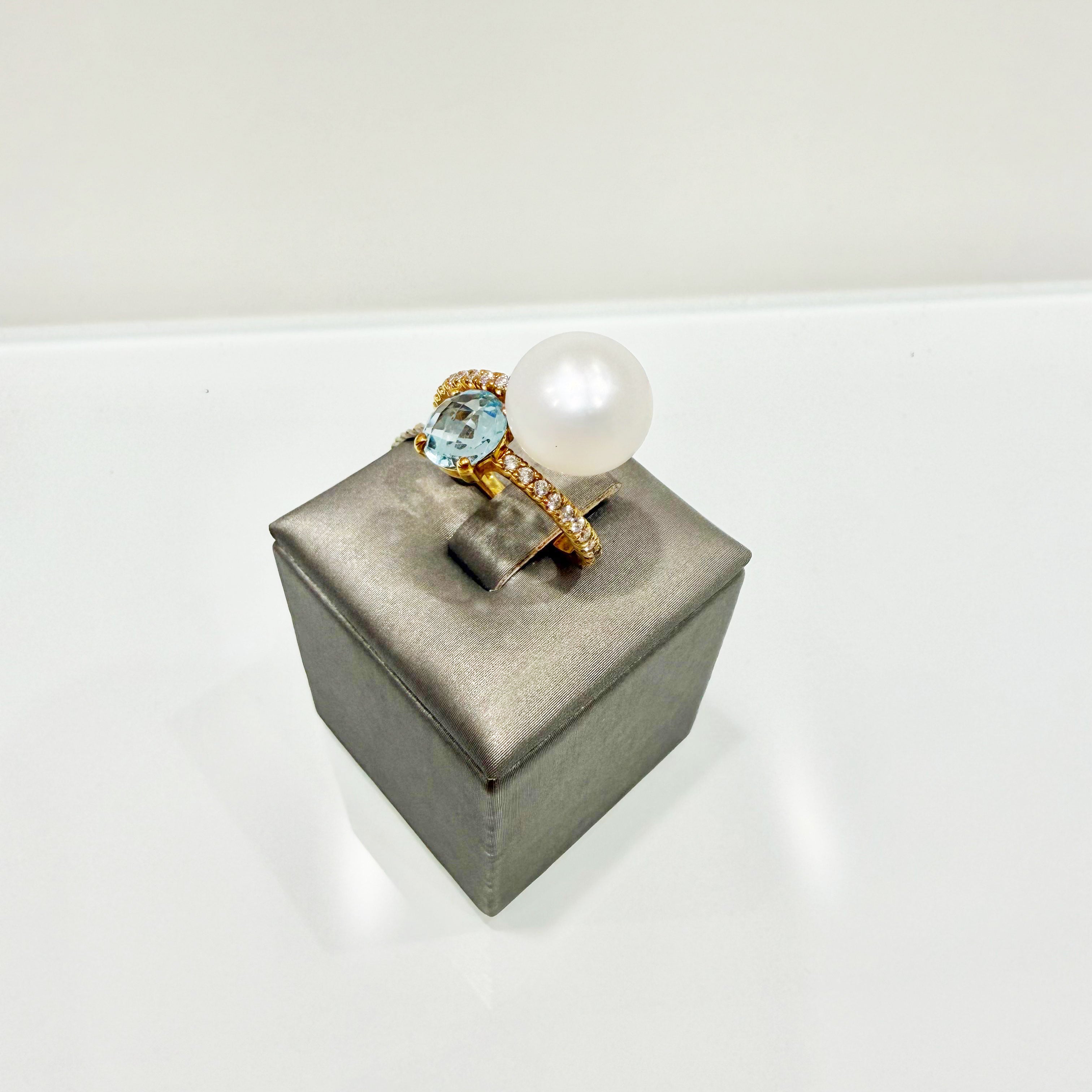 Anello contrarié con perla e topazio azzurro in oro giallo 18KT (750) con zirconi – Made in Italy