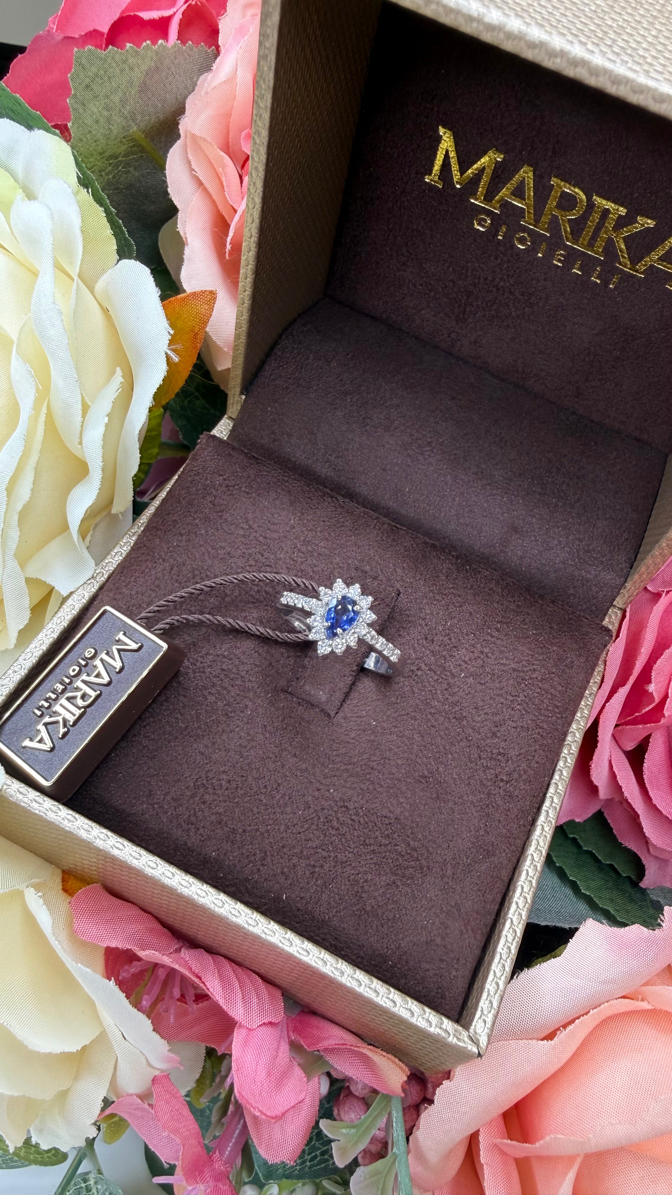 18KT WHITE GOLD DROP RING WITH DIAMONDS AND SAPPHIRE