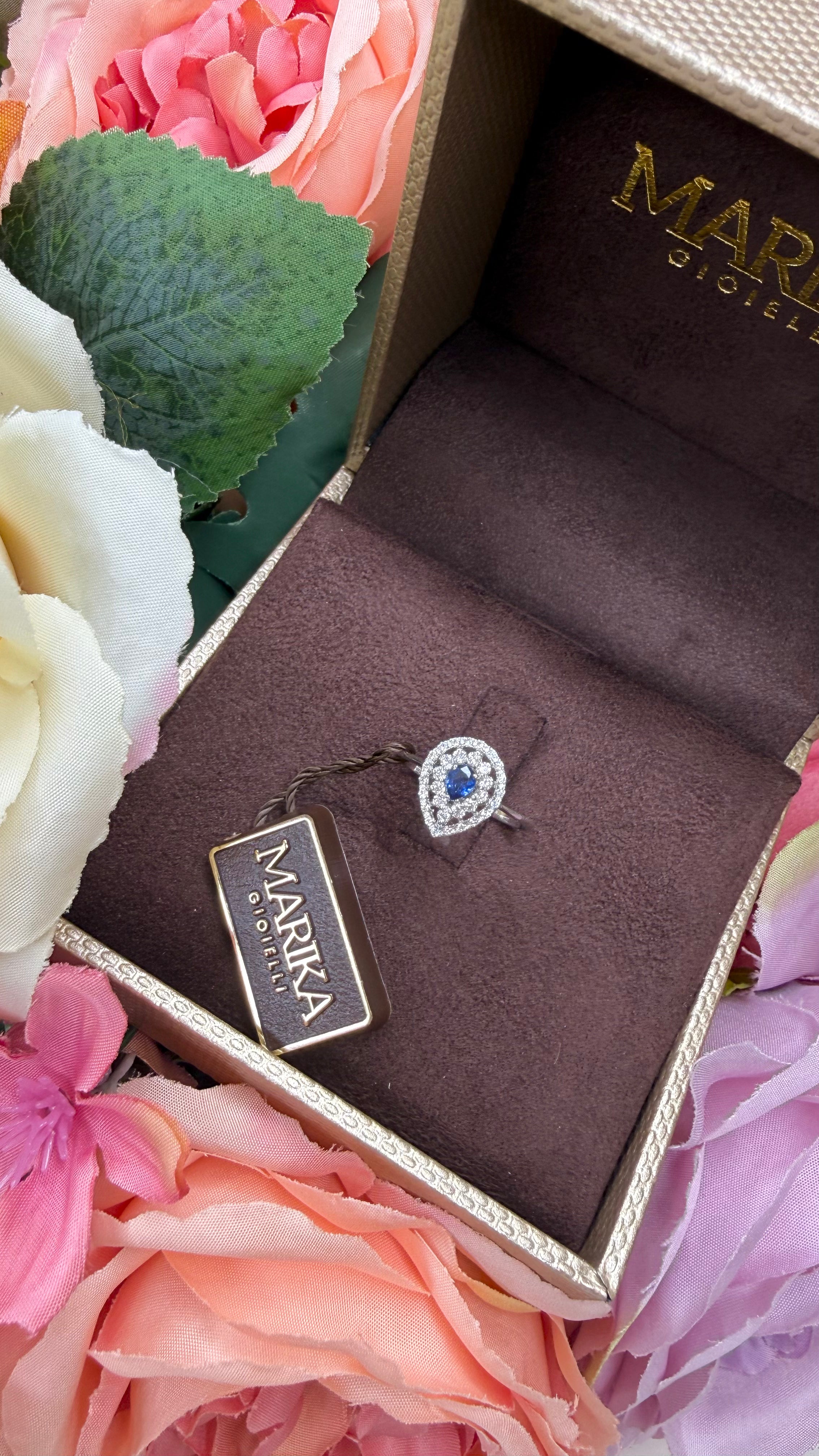 18KT WHITE GOLD DROP RING WITH DIAMONDS AND SAPPHIRE