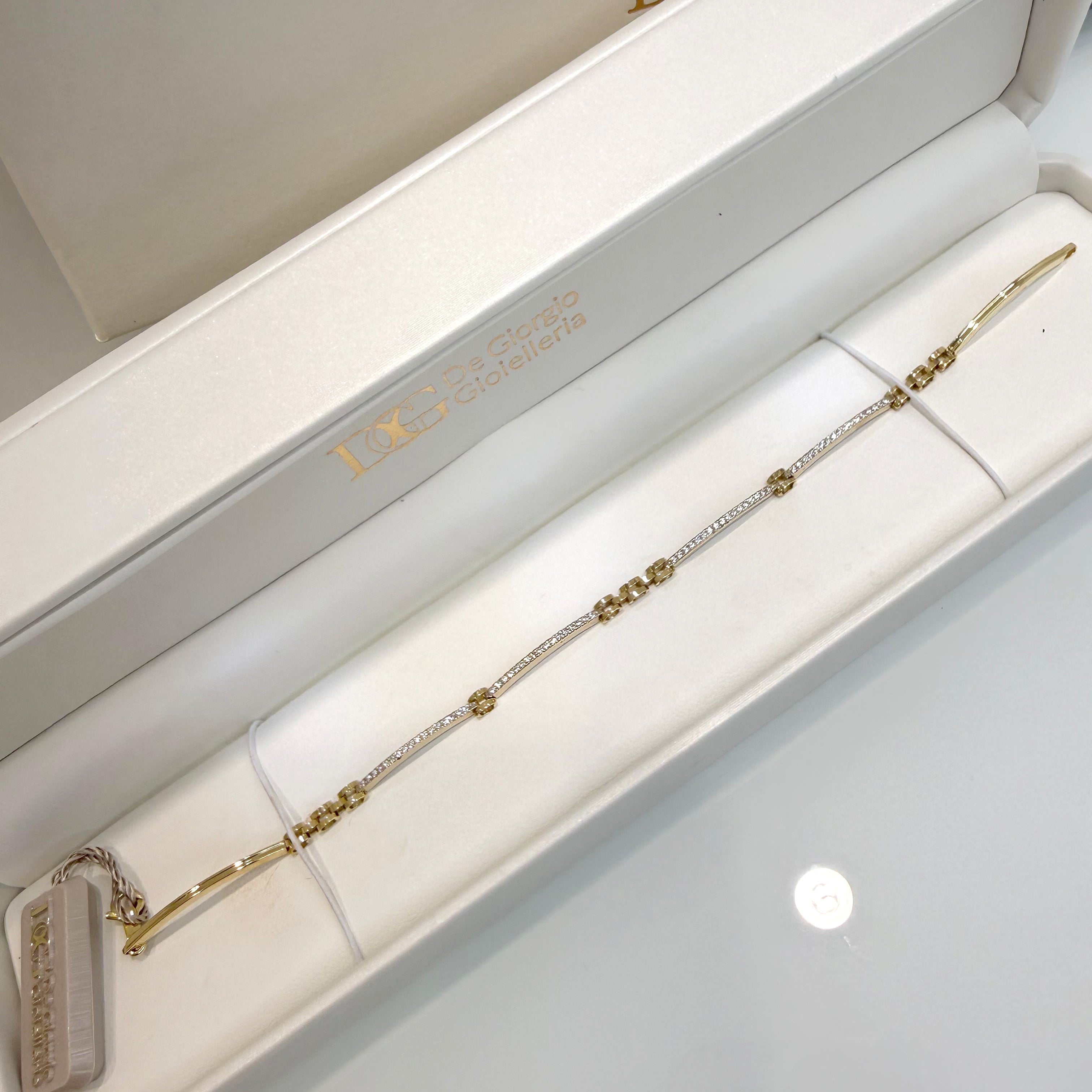 Bracciale semirigido con zirconi in oro giallo 18KT (750) – Made in Italy