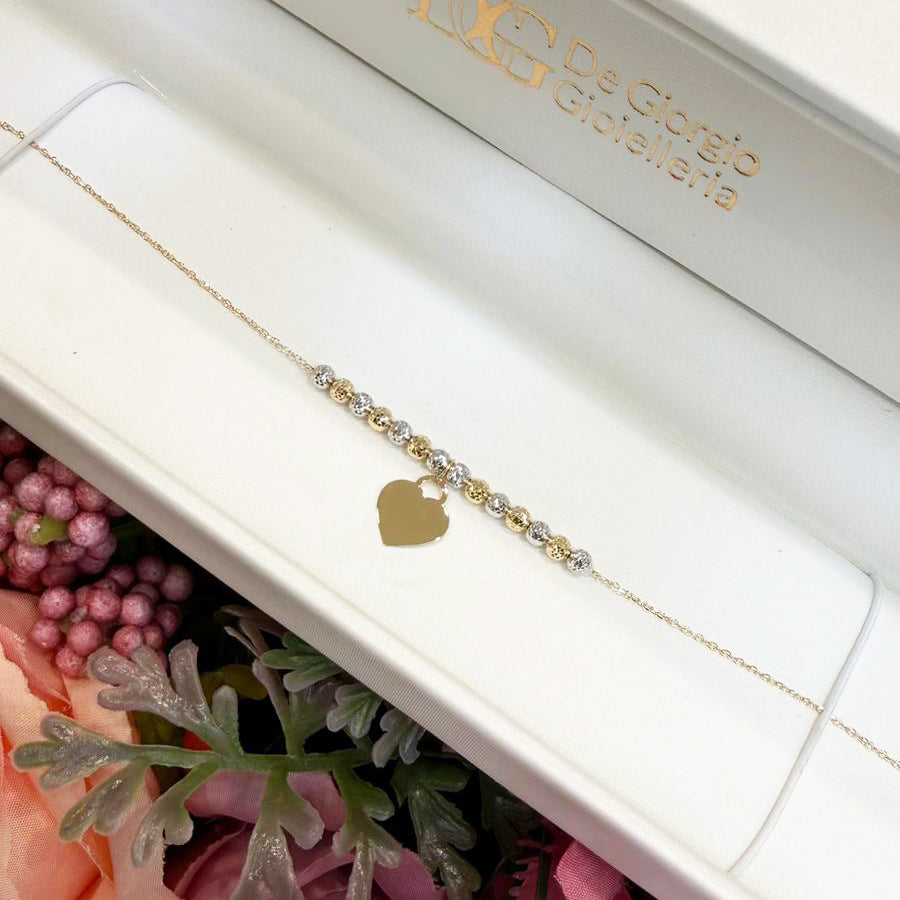 Bracciale con sfere diamantate bicolore e cuore in oro giallo 18 KT (750)