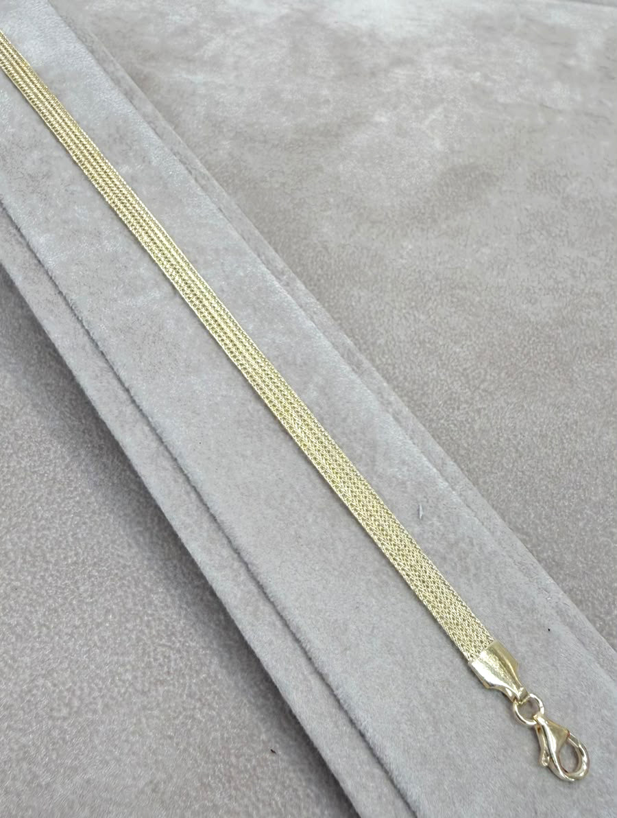 BRACCIALE A FASCIA LAVORATA IN ORO GIALLO 18 KT