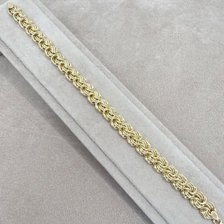 BRACCIALE A MAGLIE INTRECCIATE IN ORO GIALLO 18 KT