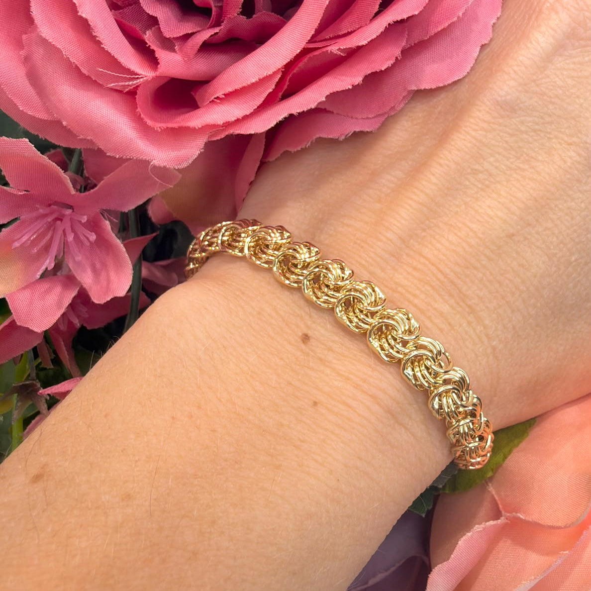 BRACCIALE A MAGLIE INTRECCIATE IN ORO GIALLO 18 KT
