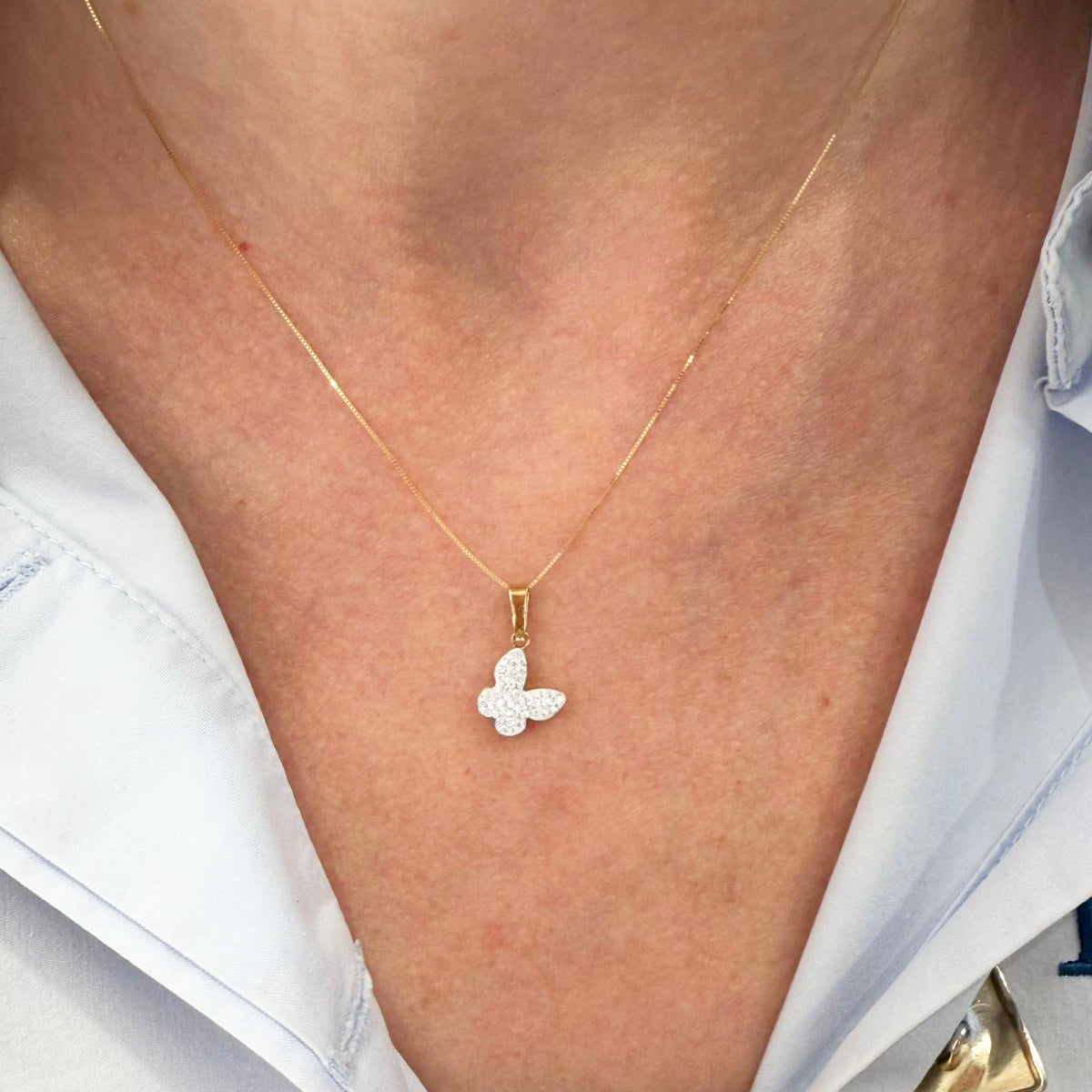 Ciondolo farfalla da donna con zirconi in oro giallo 18 Kt (750)