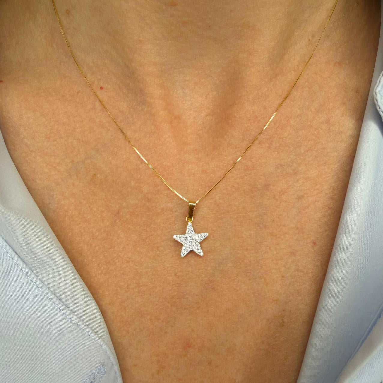 Ciondolo stella da donna con zirconi in oro giallo 18 Kt (750)