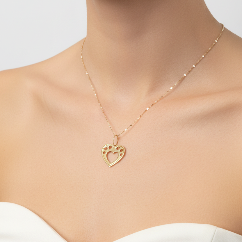 Collana con cuore traforato e cuoricini in oro giallo 18 KT (750)
