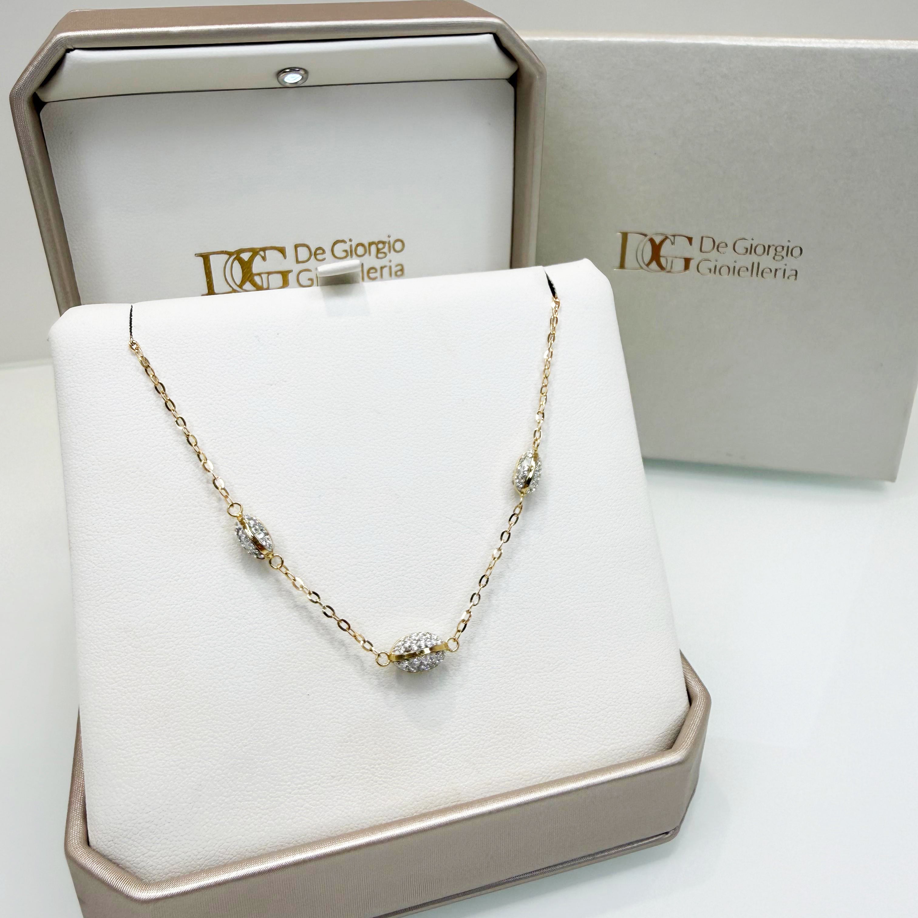 Collana con elementi ovali e zirconi in oro giallo e bianco 18KT (750) – Made in Italy