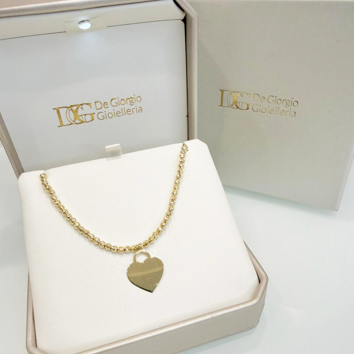 Collana con cuore incidibile in oro giallo 18KT (750) e sfere diamantate