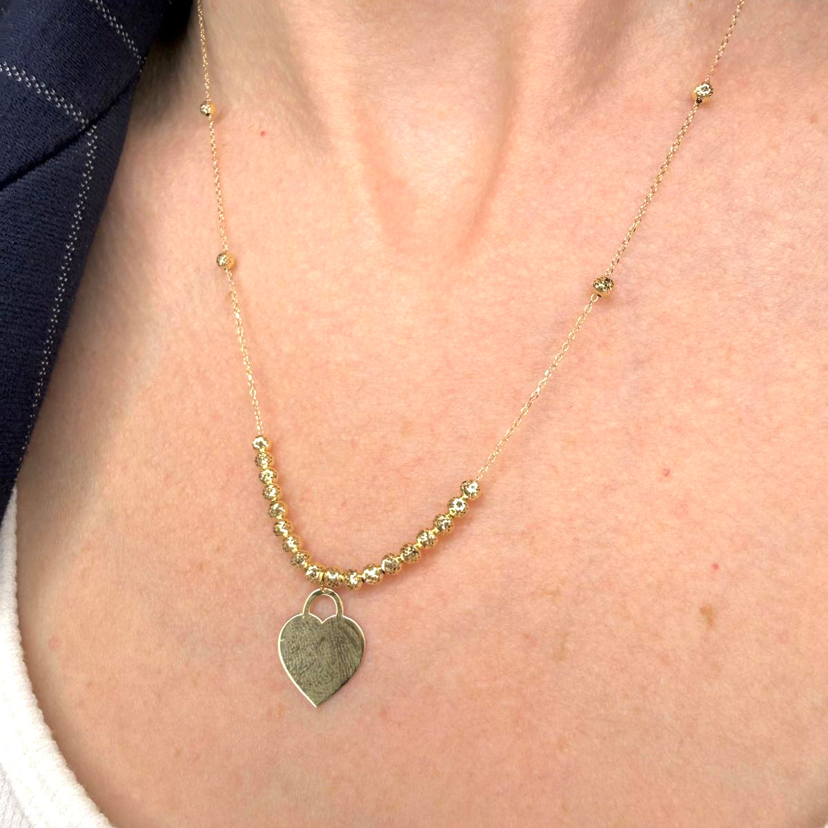 Collana con cuore incidibile in oro giallo 18KT (750) e sfere diamantate