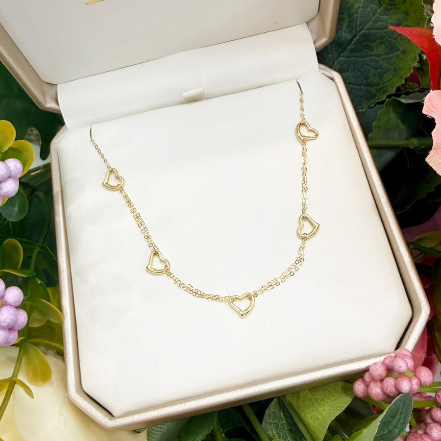 Collana con cuori traforati in oro giallo 18 KT (750)