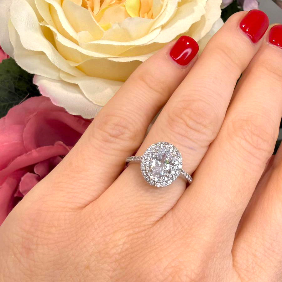 Anello solitario con zirconi in oro bianco 18KT (750)