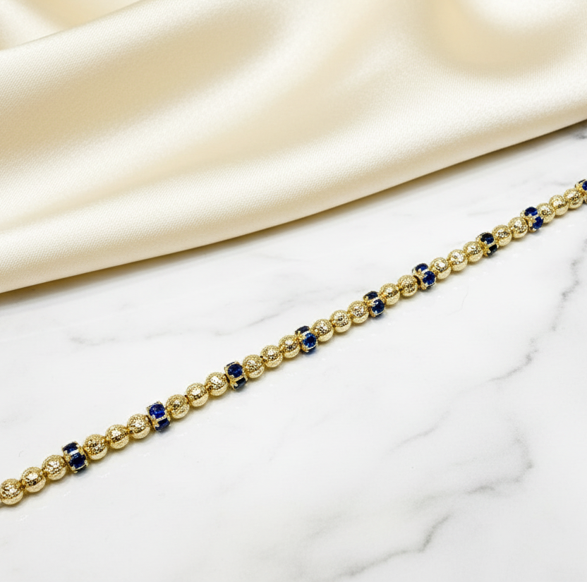 Bracciale in oro giallo 18KT (750) con sfere diamantate e elementi blu