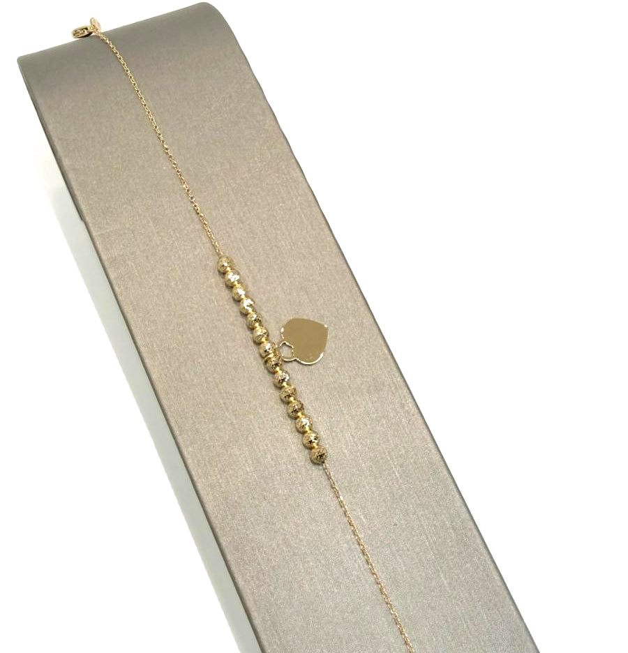 Bracciale con sfere diamantate e cuore in oro giallo 18 KT (750)
