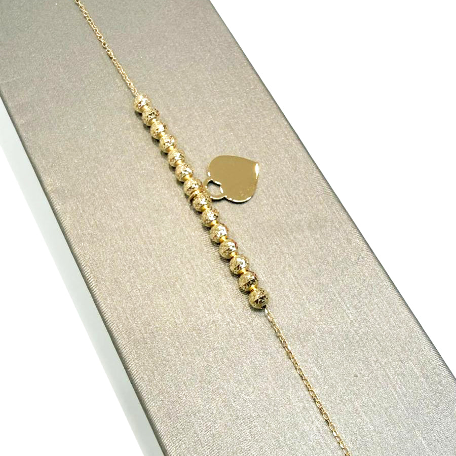 Bracciale con sfere diamantate e cuore in oro giallo 18 KT (750)