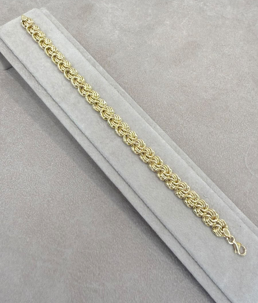 BRACCIALE A MAGLIE INTRECCIATE IN ORO GIALLO 18 KT