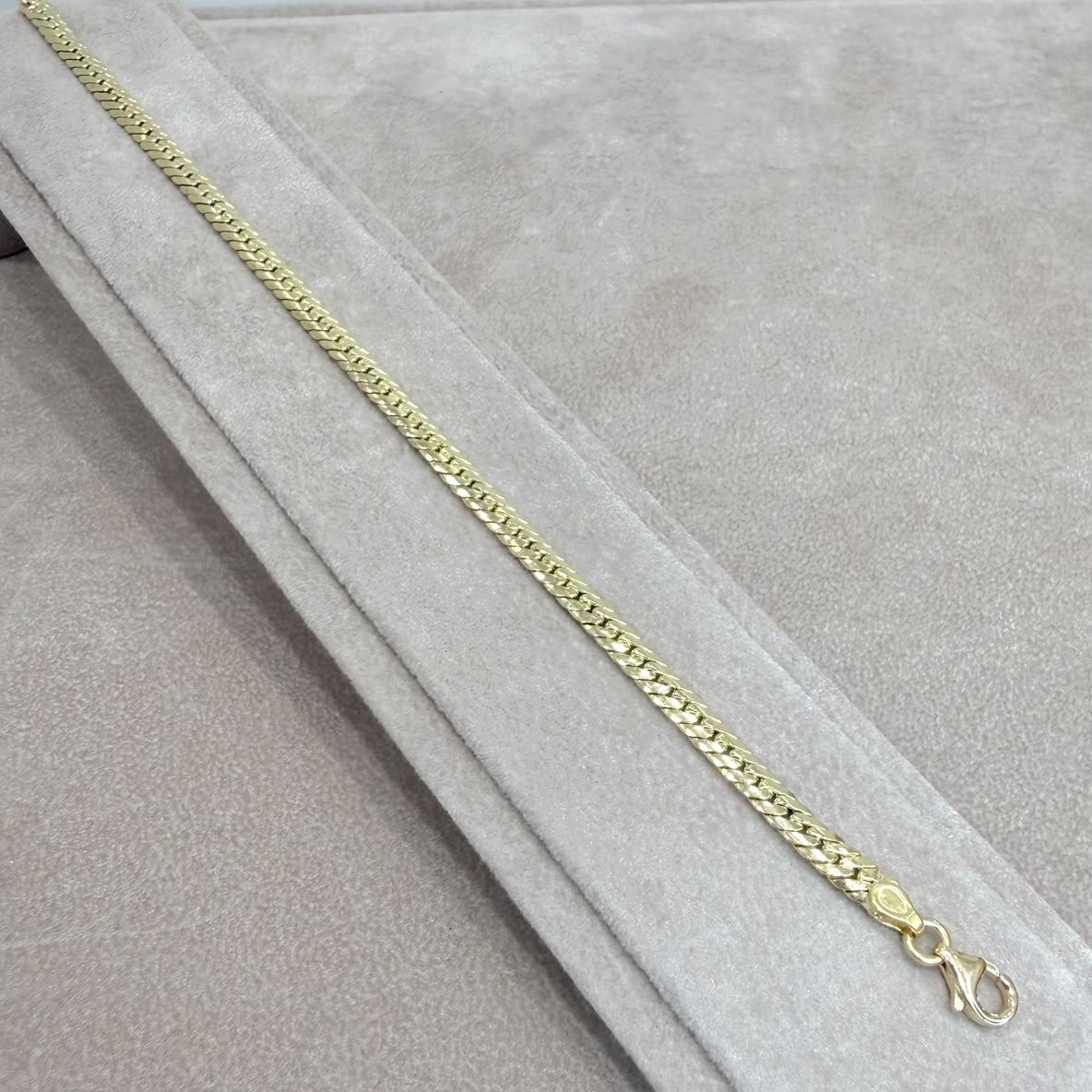 BRACCIALE A MAGLIA PIATTA LAVORATA IN ORO GIALLO 18 KT