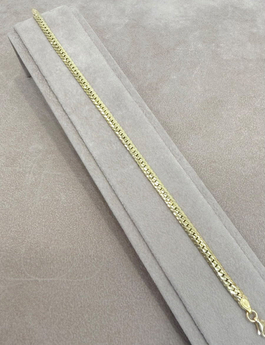BRACCIALE A MAGLIA PIATTA LAVORATA IN ORO GIALLO 18 KT