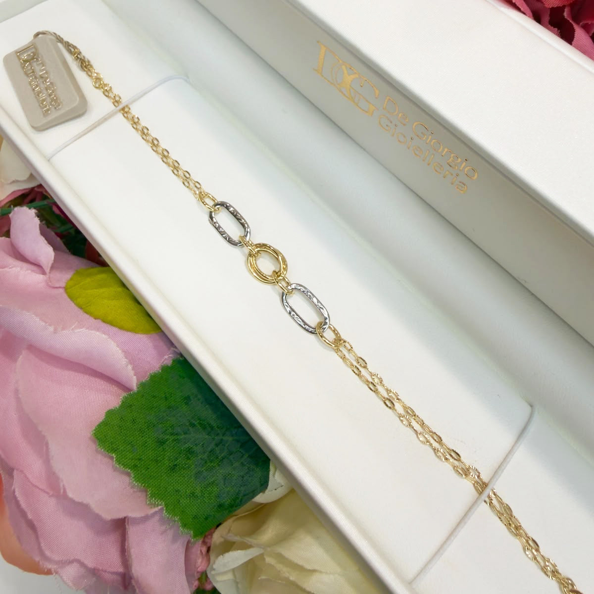 BRACCIALE IN ORO GIALLO E BIANCO 18 KT (750) CON ELEMENTI OVALI
