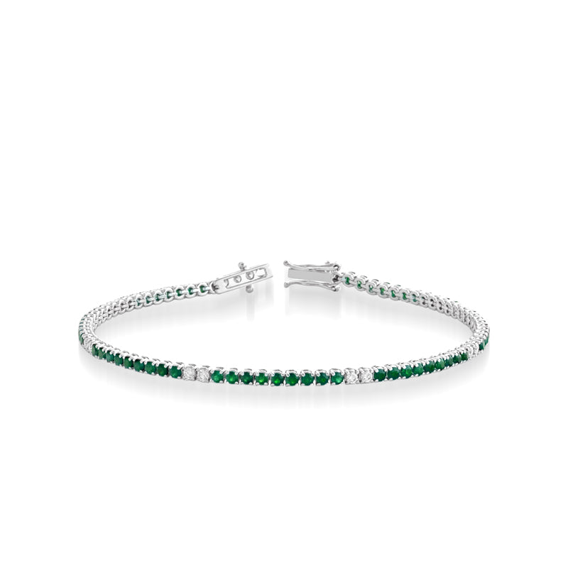 BRACCIALE TENNIS IN ORO BIANCO 18KT CON DIAMANTI E SMERALDI