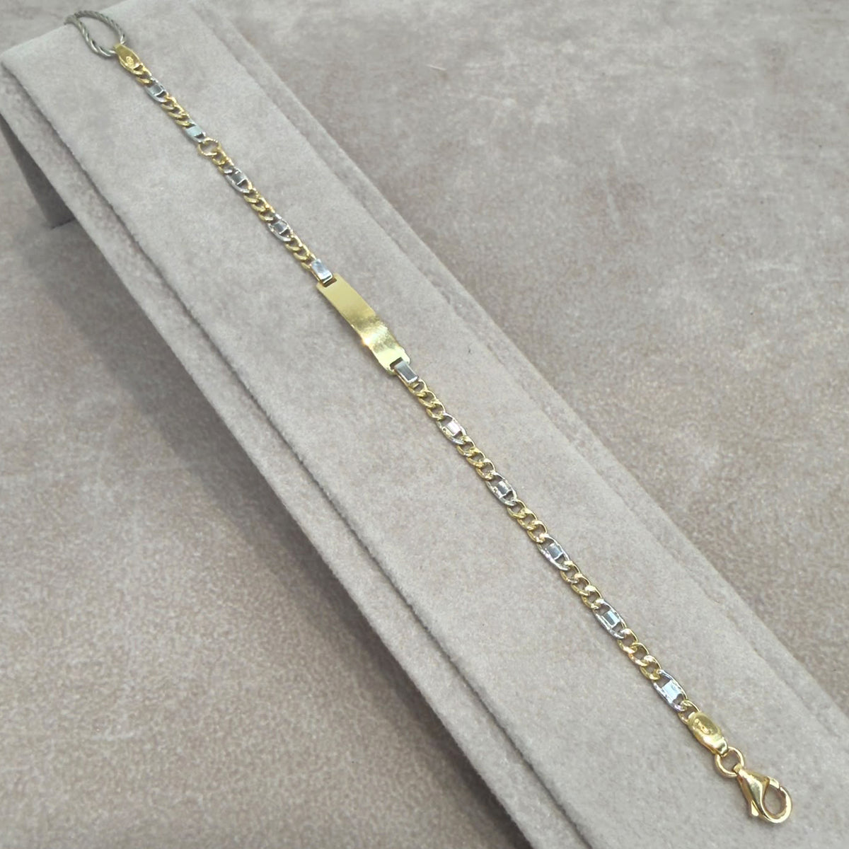 BRACCIALE BIMBO CON TARGHETTA IN ORO GIALLO E BIANCO 18 KT (750)