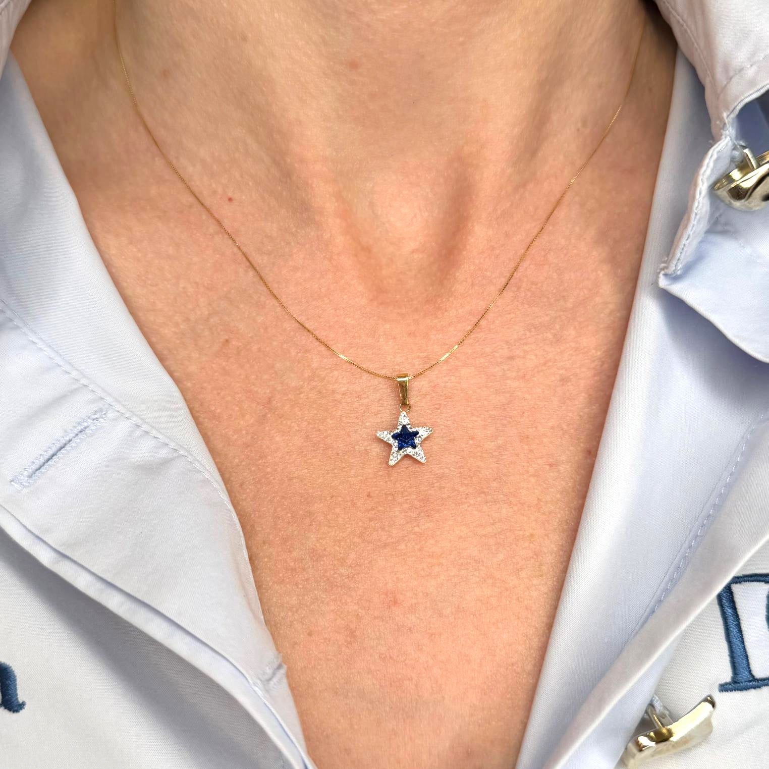 Ciondolo stella da donna con pietra blu e zirconi in oro giallo 18 Kt (750)
