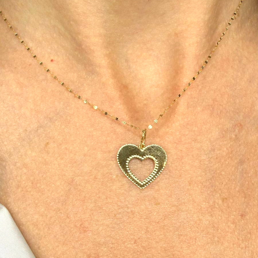 Collana con cuore traforato e bordo lavorato in oro giallo 18 KT (750)