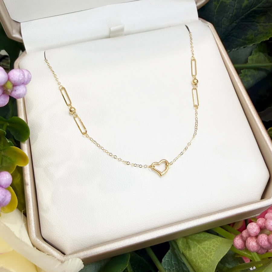 Collana con cuore e maglie geometriche in oro giallo 18 KT (750)