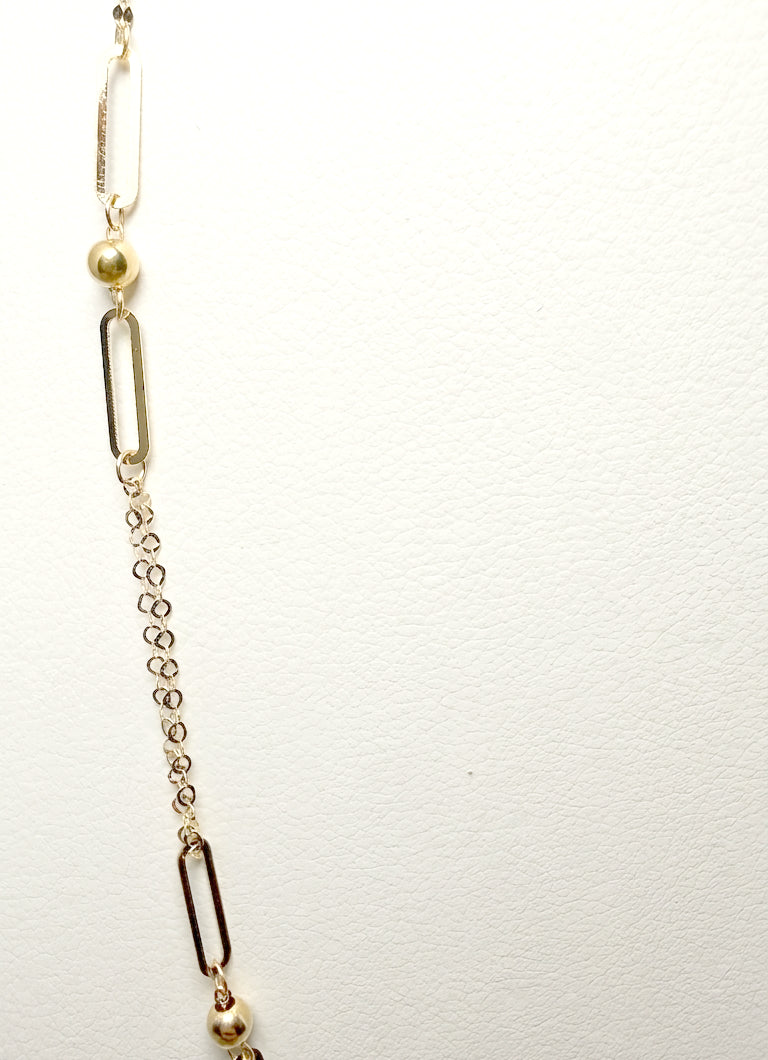 Collana con maglie geometriche e sfere in oro giallo 18 KT (750)