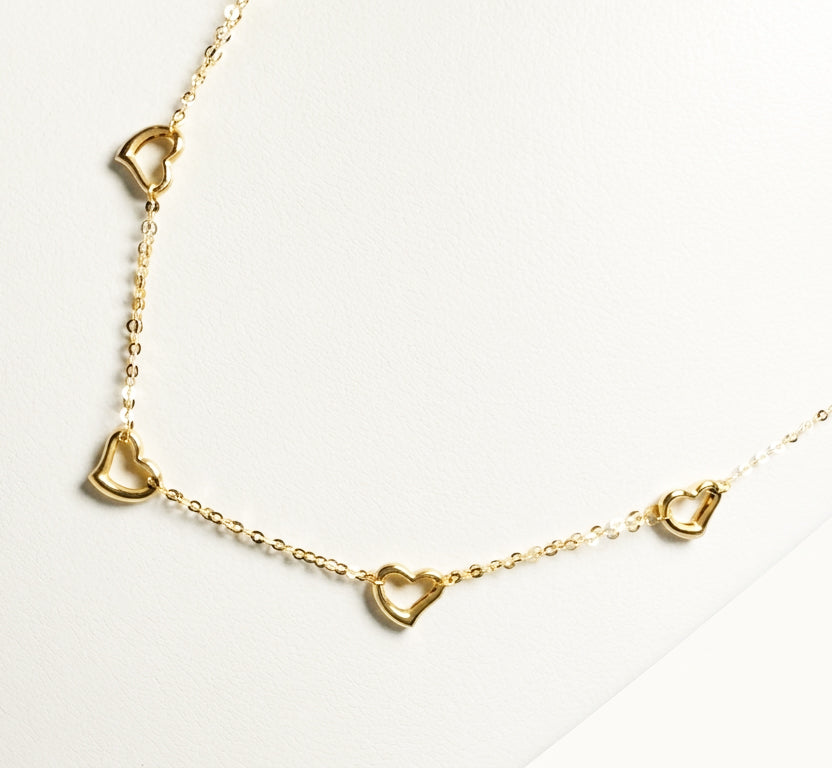 Collana con cuori traforati in oro giallo 18 KT (750)