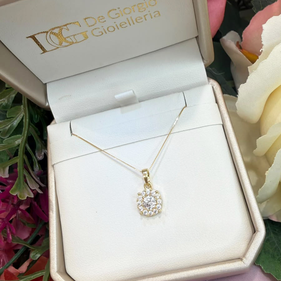 COLLANA CON PENDENTE PUNTO LUCE TONDO CON ZIRCONI IN ORO GIALLO 18 KT