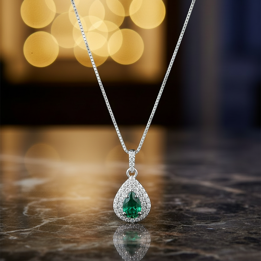 COLLANA GOCCIA IN ORO BIANCO 18KT CON DIAMANTI E SMERALDO